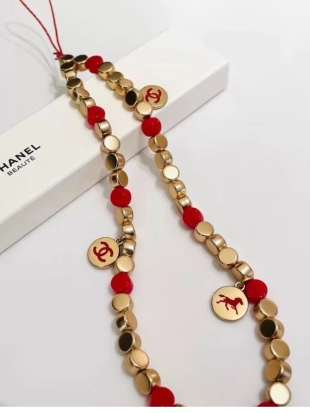 Chanel beauty Christmas gift phone charm